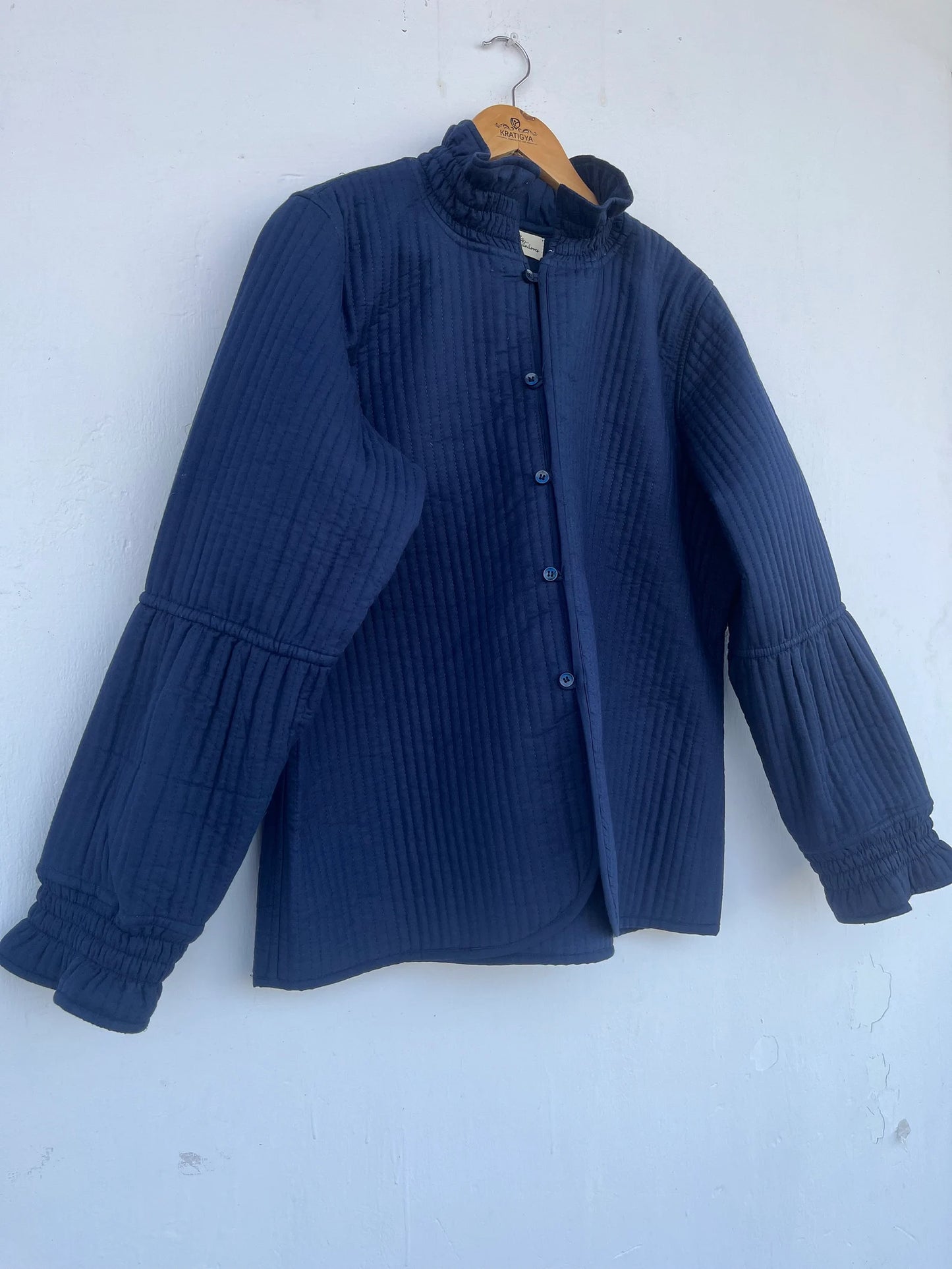 QUILTED cotton blue jacket with ruffle collar