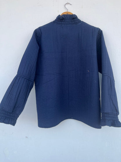 QUILTED cotton blue jacket with ruffle collar